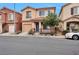 Inviting two-story home featuring a covered porch, desert landscaping, and a private driveway at 6891 Nickel Mine Ave, Las Vegas, NV 89122