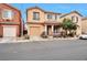 Charming two-story home with a well-manicured front yard and inviting front porch at 6891 Nickel Mine Ave, Las Vegas, NV 89122