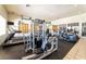 Well-equipped gym with cardio machines, weightlifting stations, and natural light for a healthy lifestyle at 6891 Nickel Mine Ave, Las Vegas, NV 89122