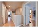 Hallway with wood-look flooring and doors leading to various rooms at 6891 Nickel Mine Ave, Las Vegas, NV 89122