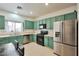 Bright kitchen featuring stainless steel appliances and stylish sage cabinetry at 6891 Nickel Mine Ave, Las Vegas, NV 89122