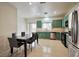 Eat in kitchen with stainless steel appliances and adjacent dining area at 6891 Nickel Mine Ave, Las Vegas, NV 89122