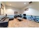 Comfortable lounge area with leather seating, TV, and modern decor, ideal for relaxation at 6891 Nickel Mine Ave, Las Vegas, NV 89122