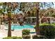 Community pool with lounge chairs and lush landscaping for relaxation and recreation at 6891 Nickel Mine Ave, Las Vegas, NV 89122