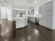 Bright, open kitchen features a large island, gray cabinetry, and stainless-steel appliances at 7110 Brighton Village St, Las Vegas, NV 89166