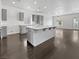 This modern kitchen features gray cabinetry, a large center island, and stainless steel appliances at 7110 Brighton Village St, Las Vegas, NV 89166