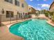 Backyard with a refreshing pool, spa, and fenced-in patio area, perfect for outdoor entertaining at 7110 Brighton Village St, Las Vegas, NV 89166