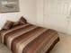 Bedroom with neutral carpet, light walls, and a queen-size bed at 7456 Oatman Ln, Las Vegas, NV 89120