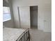Bedroom featuring closet with sliding doors, neutral paint, and carpet at 7456 Oatman Ln, Las Vegas, NV 89120