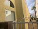 A home's exterior with stucco walls, white trim, and ornamental ironwork at 7456 Oatman Ln, Las Vegas, NV 89120