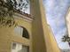 The tan exterior shows an arched window above a standard one at 7456 Oatman Ln, Las Vegas, NV 89120