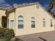 Side view of a tan single story home showing many windows at 7456 Oatman Ln, Las Vegas, NV 89120