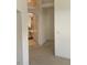 Hallway featuring an archway, neutral paint, and access to other rooms in the home at 7456 Oatman Ln, Las Vegas, NV 89120