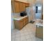 Open concept kitchen with wood cabinets, white countertops, and stainless steel appliances at 7456 Oatman Ln, Las Vegas, NV 89120