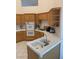 Bright kitchen with wood cabinets, white countertops, and double oven appliance at 7456 Oatman Ln, Las Vegas, NV 89120