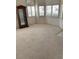 Neutral carpet and white walls create a spacious feel at 7456 Oatman Ln, Las Vegas, NV 89120