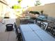 Private backyard oasis perfect for outdoor gatherings, complete with patio furniture and gravel at 7613 Falconwing Ave, Las Vegas, NV 89131