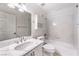 Well-lit bathroom boasts a shower-over-tub combo and a vanity with white countertop at 7613 Falconwing Ave, Las Vegas, NV 89131