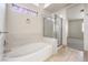 Bathroom featuring bathtub and walk-in shower at 7613 Falconwing Ave, Las Vegas, NV 89131
