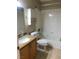 Functional bathroom with granite vanity, tiled floors, and tub, designed for convenience and style at 7613 Falconwing Ave, Las Vegas, NV 89131