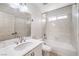 Bright bathroom featuring a single sink vanity with a white countertop and a shower over tub combination at 7613 Falconwing Ave, Las Vegas, NV 89131
