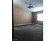 Spacious bedroom with neutral walls, plush carpet, and a ceiling fan providing a comfortable atmosphere at 7613 Falconwing Ave, Las Vegas, NV 89131