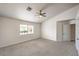 Comfortable bedroom featuring vaulted ceiling, ceiling fan, and natural light at 7613 Falconwing Ave, Las Vegas, NV 89131