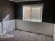 Calming bedroom with gray walls, white wainscoting, and a sunny window for a peaceful retreat at 7613 Falconwing Ave, Las Vegas, NV 89131