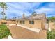 Home exterior showcases solar panels, a tiled roof, stucco walls, and a low-maintenance desert landscape at 7613 Falconwing Ave, Las Vegas, NV 89131