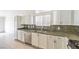 Modern kitchen featuring stainless steel appliances, double sink, and granite countertops at 7613 Falconwing Ave, Las Vegas, NV 89131