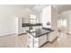 Bright kitchen with granite countertops, white cabinets, and stainless steel appliances at 7613 Falconwing Ave, Las Vegas, NV 89131