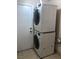 Convenient laundry area with stacked washer and dryer, optimizing space and efficiency at 7613 Falconwing Ave, Las Vegas, NV 89131