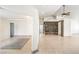 Open living space with tile flooring, modern accents, and lots of natural light, with views into other living spaces at 7613 Falconwing Ave, Las Vegas, NV 89131