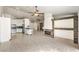 Spacious living area connects kitchen and living spaces, enhanced by a stone fireplace at 7613 Falconwing Ave, Las Vegas, NV 89131