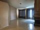 Spacious living room with tile flooring, stone fireplace, and natural light at 7613 Falconwing Ave, Las Vegas, NV 89131