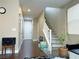 Inviting entryway with hardwood floors, a staircase, and a view of the front door at 7735 Pista Way, Las Vegas, NV 89179