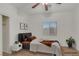 A staged bedroom with neutral decor, light hardwood flooring, and a modern bed frame at 780 Flowing Meadow Dr, Henderson, NV 89014