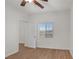 Cozy bedroom with wood floors, a ceiling fan and window with blinds at 780 Flowing Meadow Dr, Henderson, NV 89014