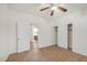 Bright bedroom with wood floors, ceiling fan, closet and bathroom access at 780 Flowing Meadow Dr, Henderson, NV 89014