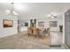 Bright dining room with chandelier, neutral walls, and tile floors at 780 Flowing Meadow Dr, Henderson, NV 89014