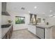 Bright kitchen area with stainless steel appliances, a gas range, and a functional island with a sink at 780 Flowing Meadow Dr, Henderson, NV 89014