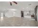 Open-concept living space featuring neutral tile flooring, recessed lighting, and seamless flow into the kitchen at 780 Flowing Meadow Dr, Henderson, NV 89014