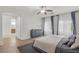 Primary bedroom featuring wood floors, ensuite bath, and natural light at 780 Flowing Meadow Dr, Henderson, NV 89014