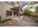 Charming backyard patio with string lights and brick pavers at 780 Flowing Meadow Dr, Henderson, NV 89014