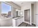 Modern bathroom with double sinks, granite countertops, and tiled shower with glass door at 8629 Ensworth St # 111, Las Vegas, NV 89123