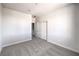 Minimalist bedroom features gray carpet, white walls, and a closet at 8629 Ensworth St # 111, Las Vegas, NV 89123