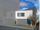 Contemporary townhome showcasing a modern design with a two-car garage, clean lines, and professional landscaping at 8629 Ensworth St # 111, Las Vegas, NV 89123