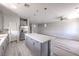 Spacious kitchen with island that opens to a living area, plus stainless steel appliances at 8629 Ensworth St # 111, Las Vegas, NV 89123