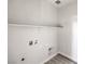 Utility room featuring modern flooring, a shelf, and washer/dryer hookups at 8629 Ensworth St # 111, Las Vegas, NV 89123