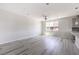 Spacious living room with light wood floors, a ceiling fan, and natural lighting at 8629 Ensworth St # 111, Las Vegas, NV 89123
